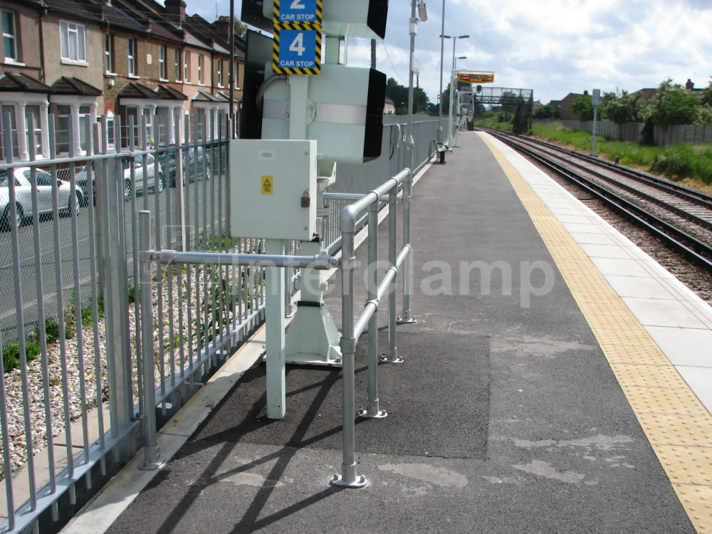 Tube clamp guardrail surround railway signalling equipment