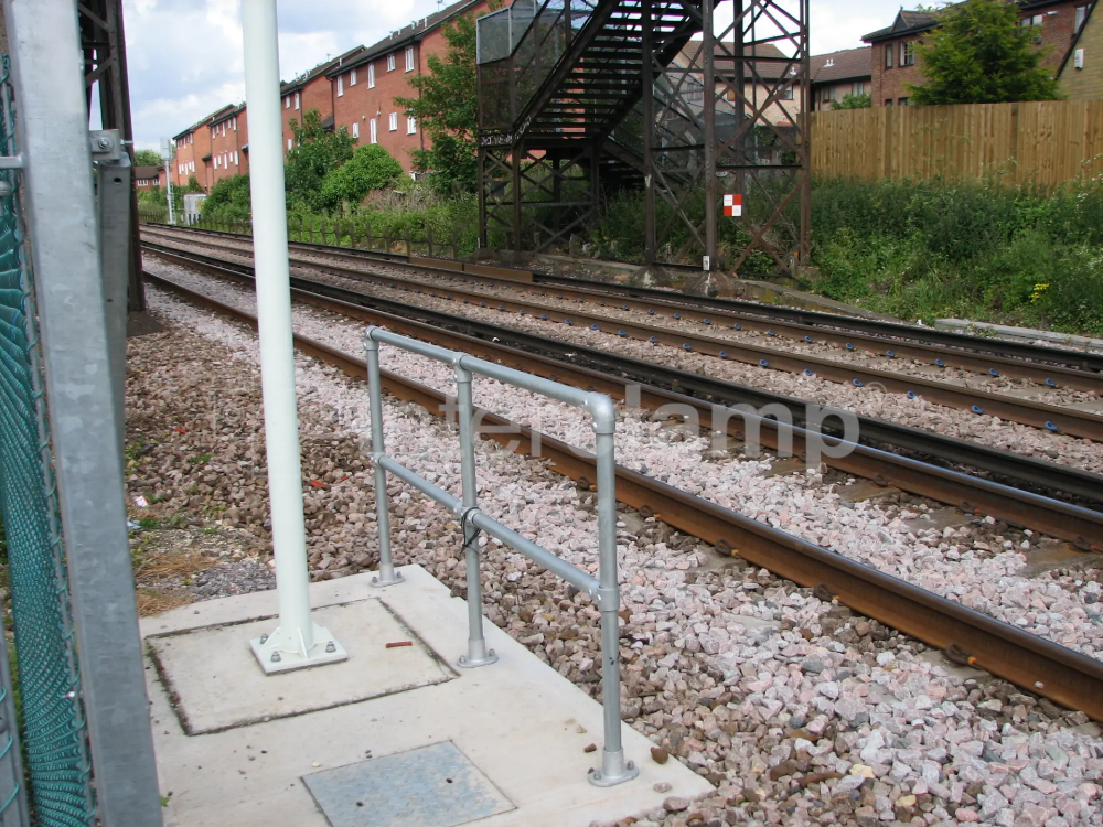 Safety guardrail at end of rail platform.